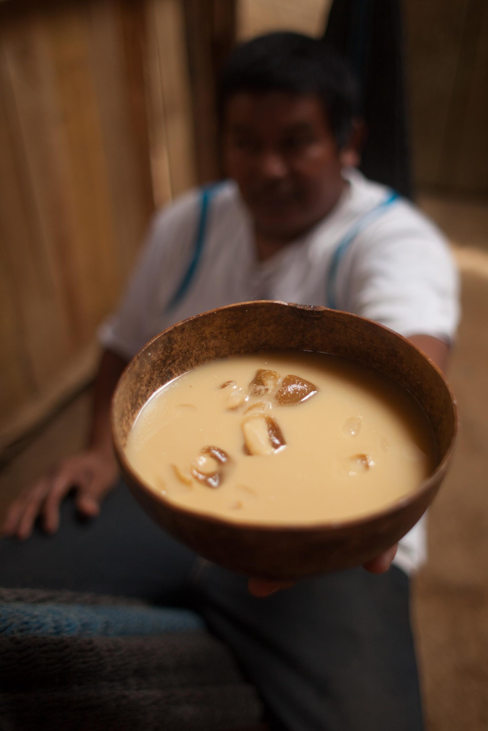 man drinking chicha